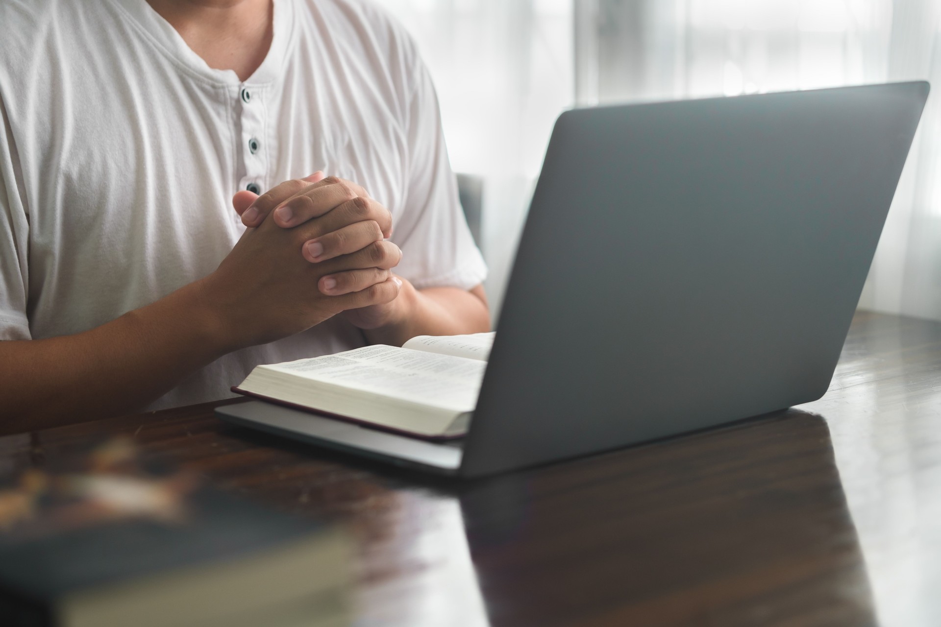 The concept of online prayer, online groups, online learning, trusting in God, using technology in religious applications, worshiping God at home or praying together online in remote areas.